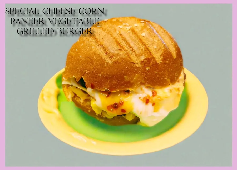 Special cheese corn paneer burger on a yellow plate