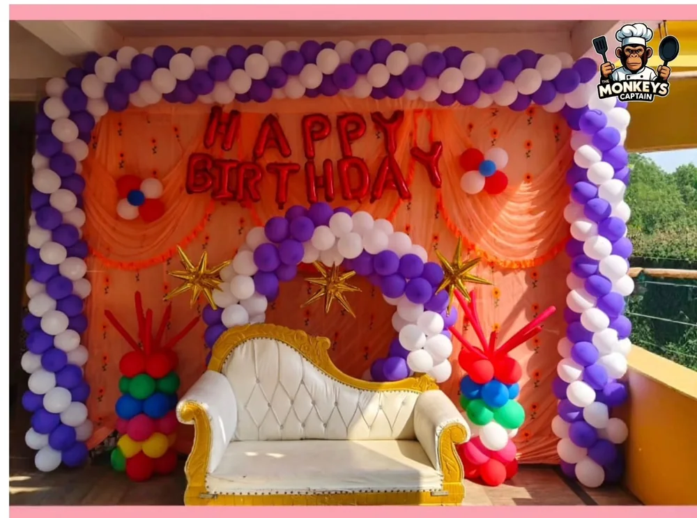 Birthday seating decoration with balloon arch