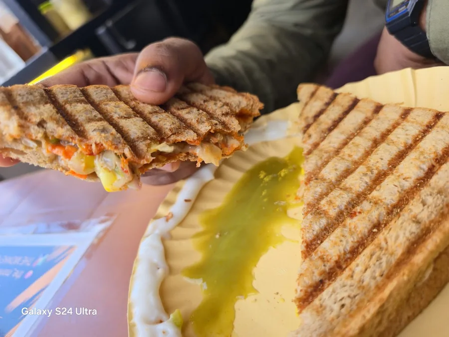 Fresh grilled sandwich served on a yellow plate